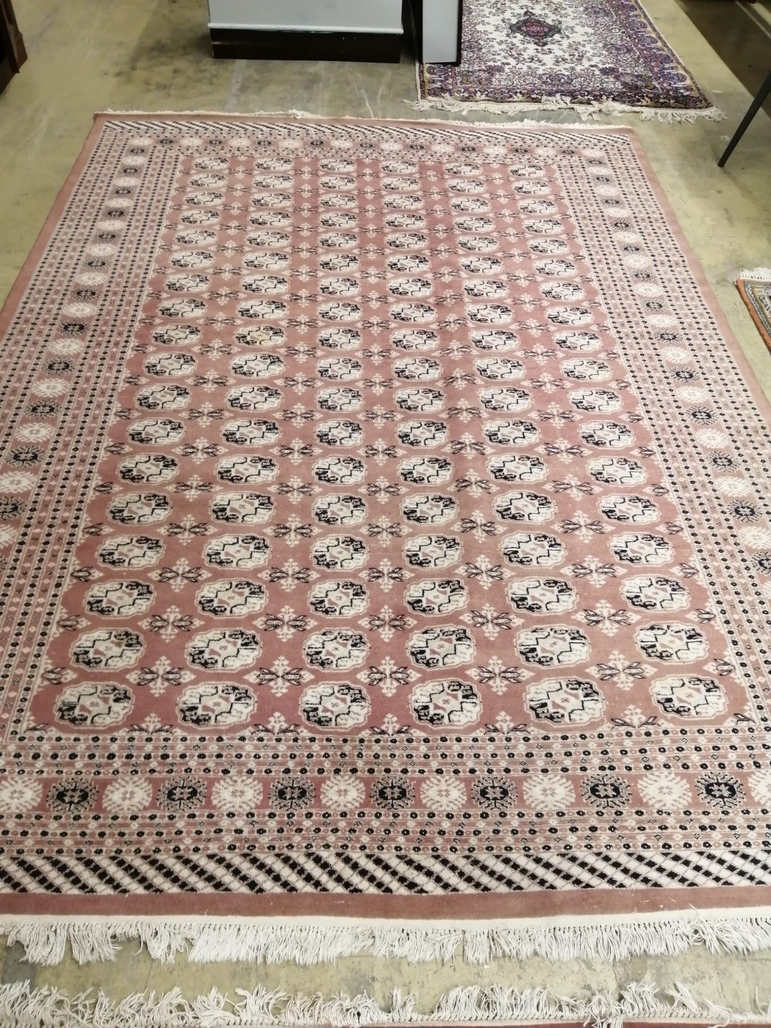 A pair of Bokhara peach ground carpets, 310 x 218cm